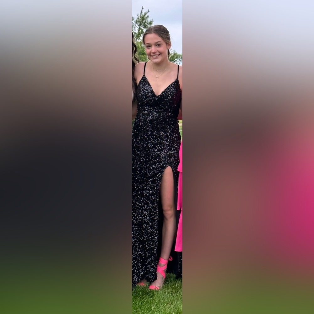 Black sequin prom dress, slit down the side, zips in the back, does not wrinkle